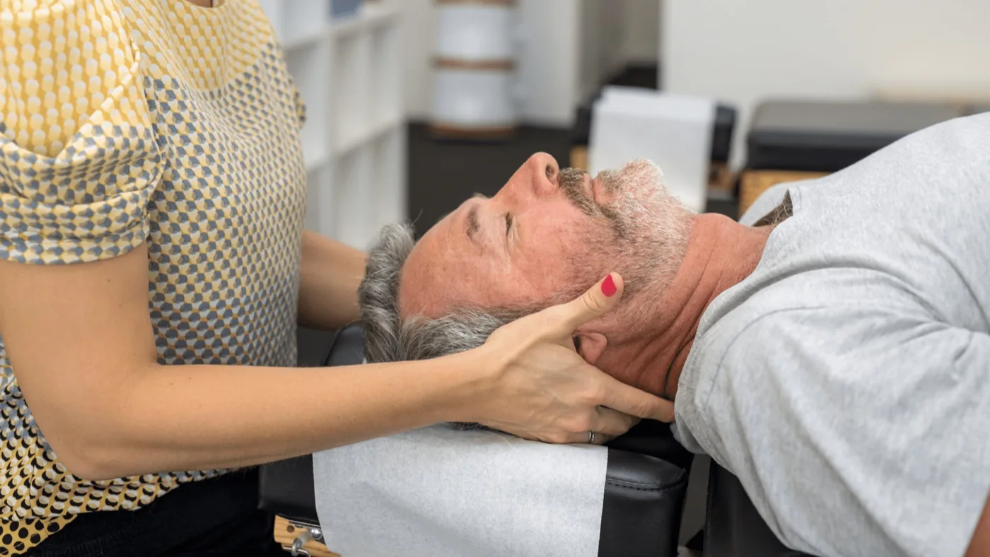 Gentle neck adjustment for neck pain and headaches at Herner Chiropractic in Nashua, NH